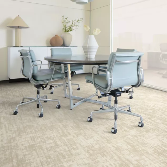 Interface Open Air 402 plank carpet tile with man working on laptop at conference table