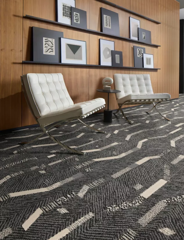 Interface Accent Hour plank carpet tile in workplace lobby with Knoll Barcelona chairs