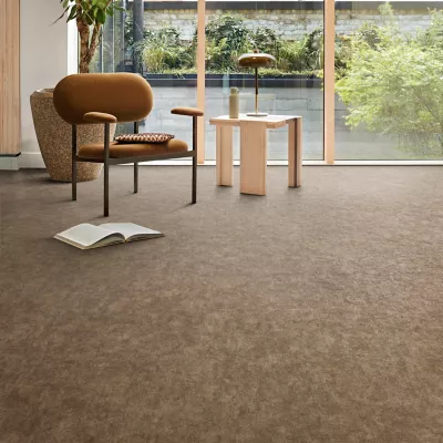 Interface plank LVT in lobby area with glass walls and multiple plants